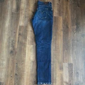 Dark blue Levi’s jeans.